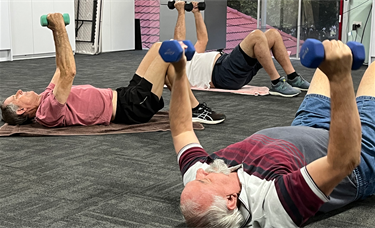 Manfit-Three-men-lifting-from-floor.png