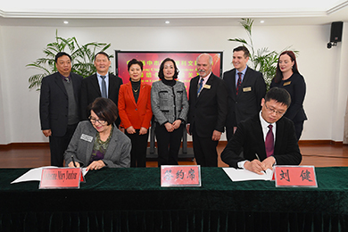 Principal Catherine Dunbar Signing Sister School Agreement with Yangzhong Baqiao Secondary School